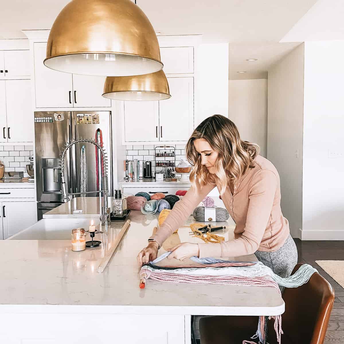 Woman in kitchen working on craft project